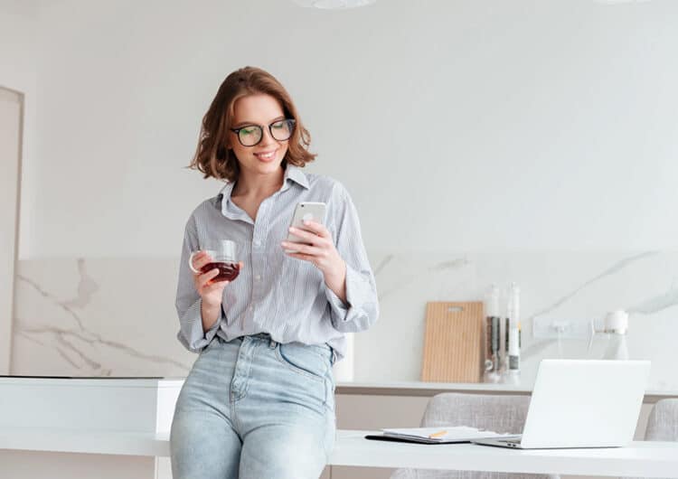 portrait happy woman using mobile phone